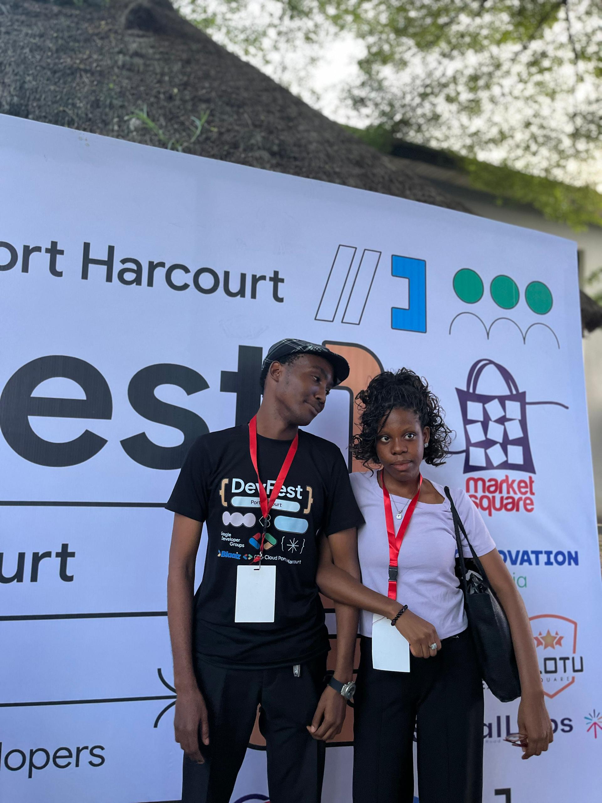 With a fellow attendee at the GDG Cloud Port Harcourt backdrop.