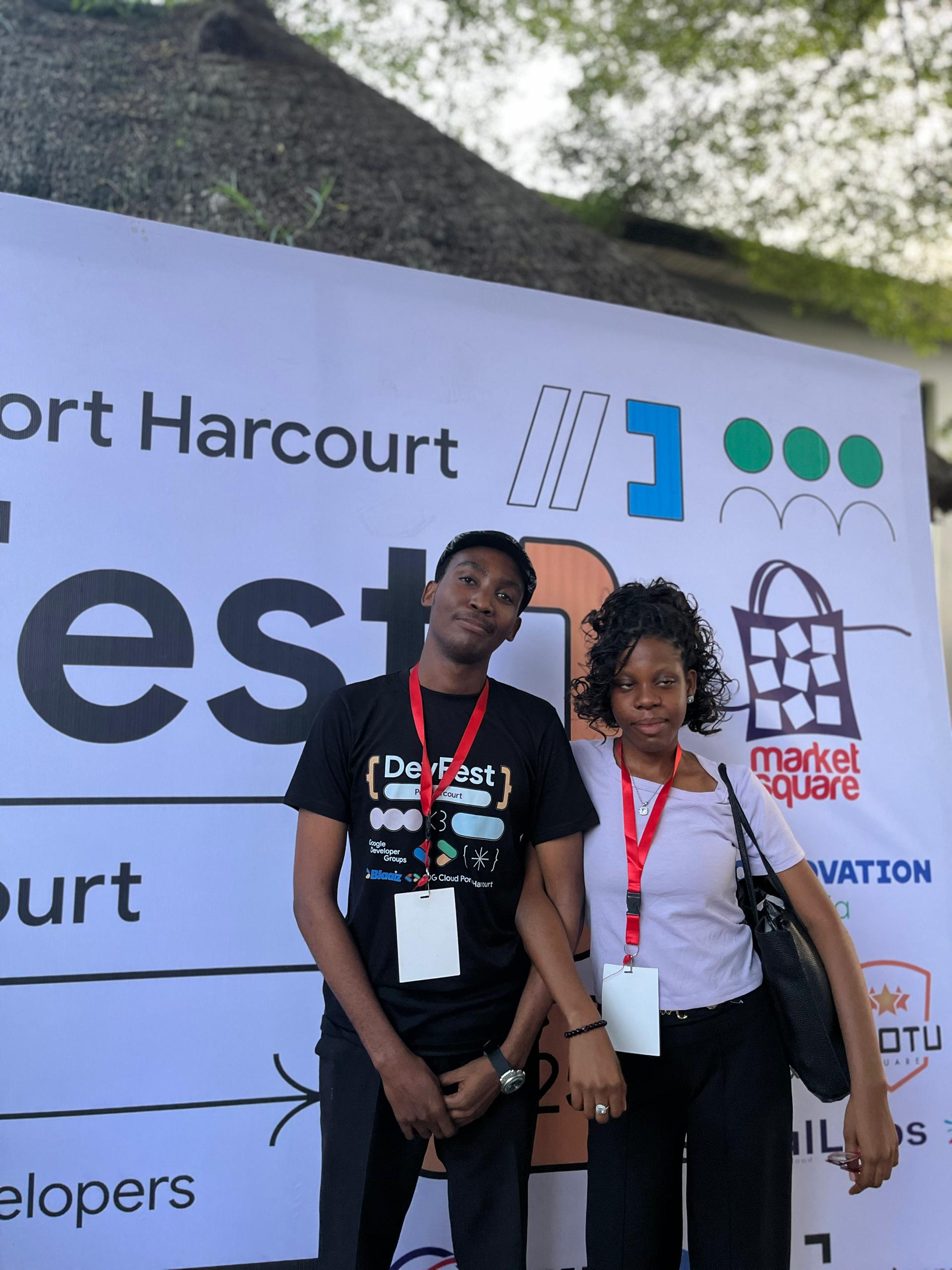With a fellow attendee at the GDG Cloud Port Harcourt backdrop.