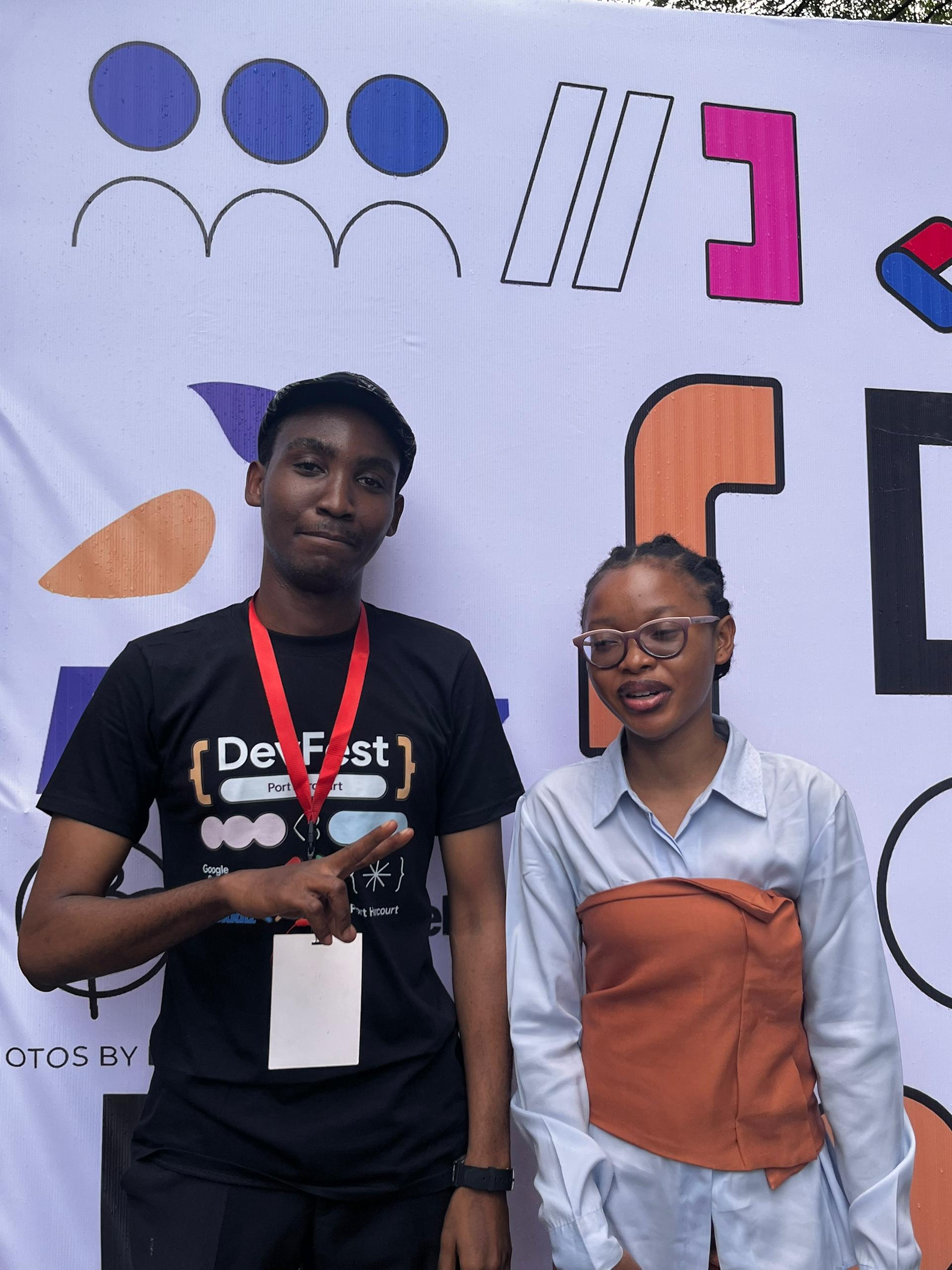 With a fellow attendee at DevFest Port Harcourt 2025.